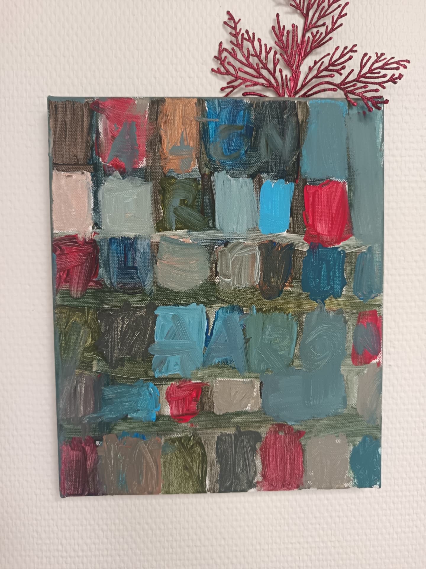 Composition de carrés colorés à la peinture réalisée par un élève